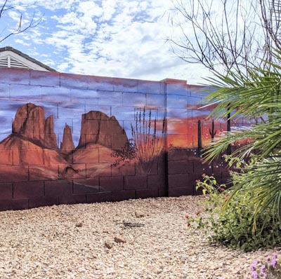 Iconic Arizona desert sunset mural featuring majestic saguaro cacti and golden skies.