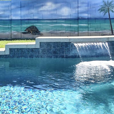 Tropical beach mural designed to complement a poolside backyard setting.
