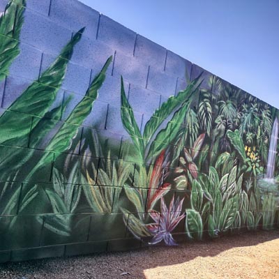 Exotic Hawaii jungle mural with a cascading waterfall for a backyard feature wall.