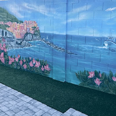 Picturesque Mediterranean coastal mural with ocean views and seaside architecture.